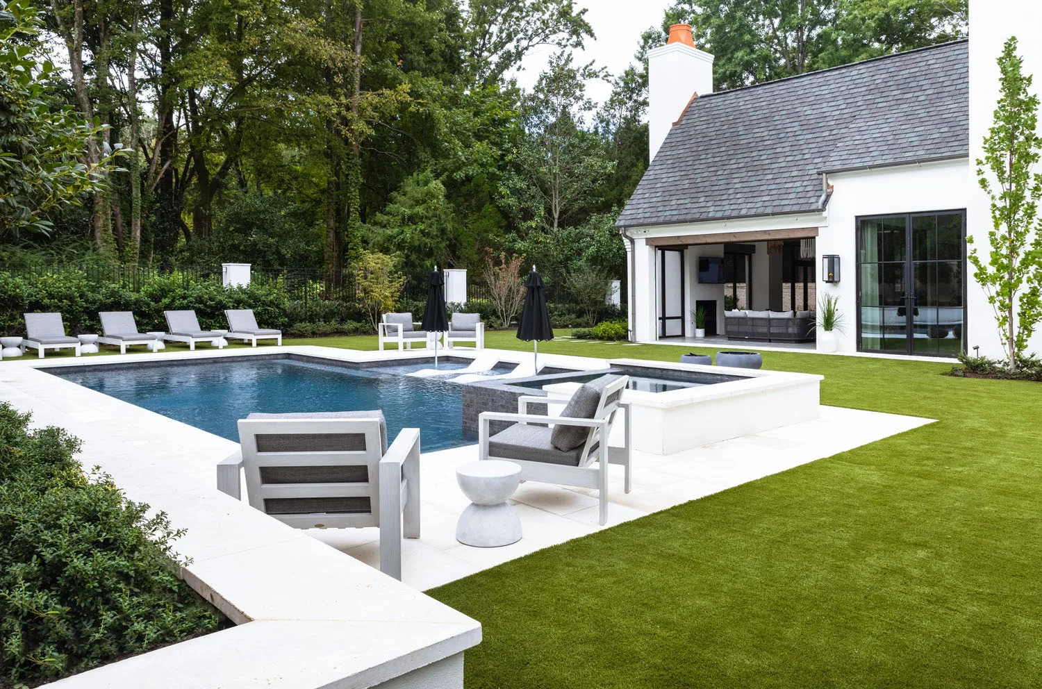 Pool terrace and outdoor seating at The Cloisters