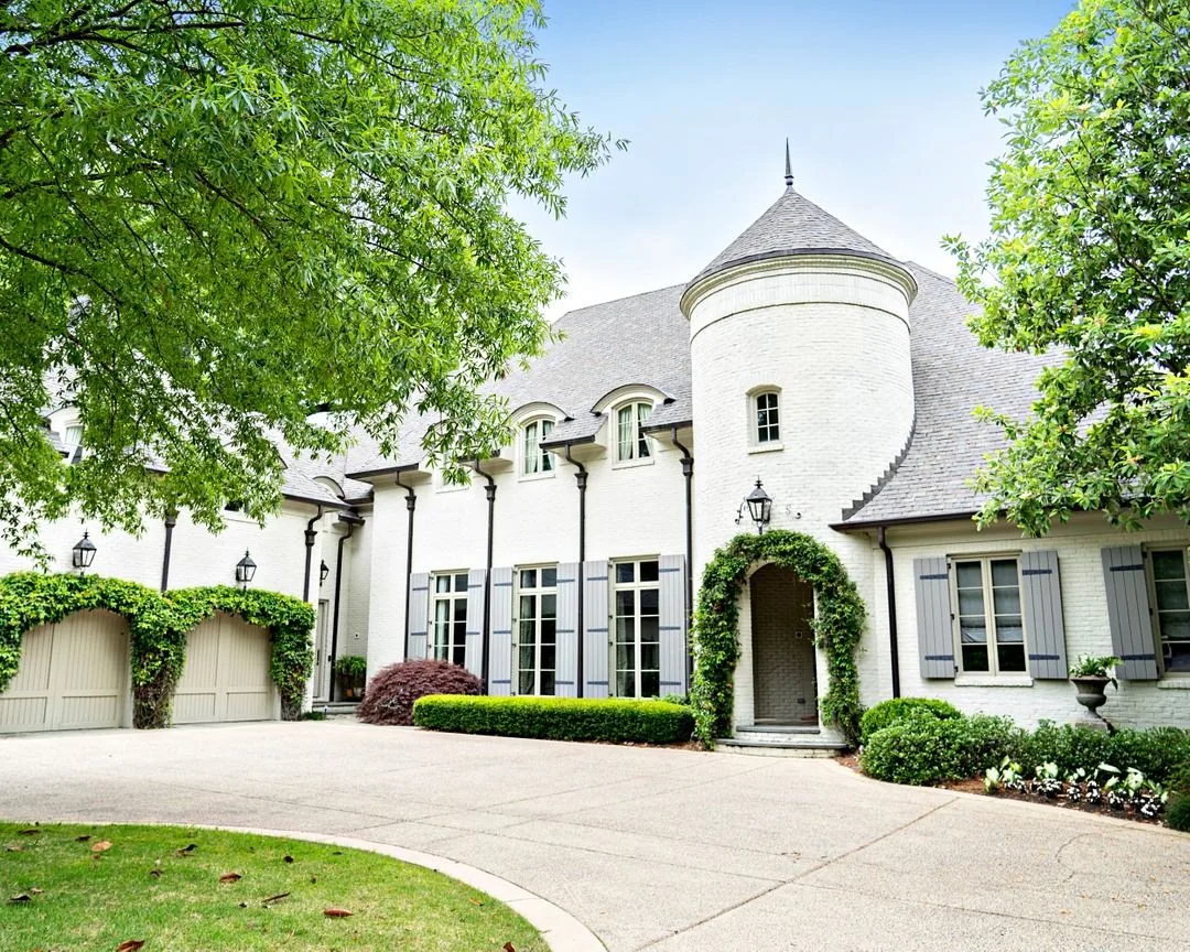 Front elevation of a finished custom residential home showcasing architectural design