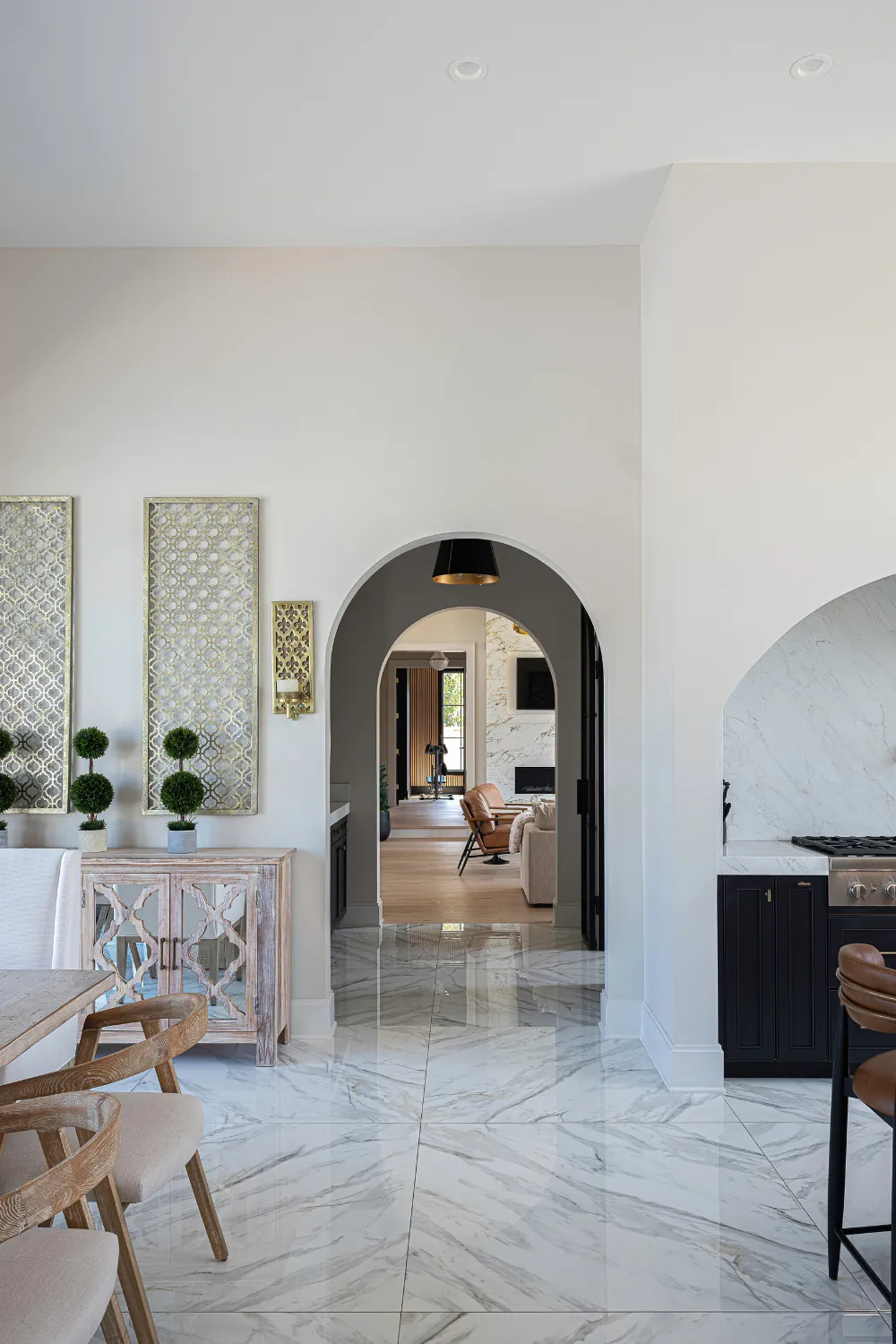 Interior hall with repeating arched doors at the Williamson Residence