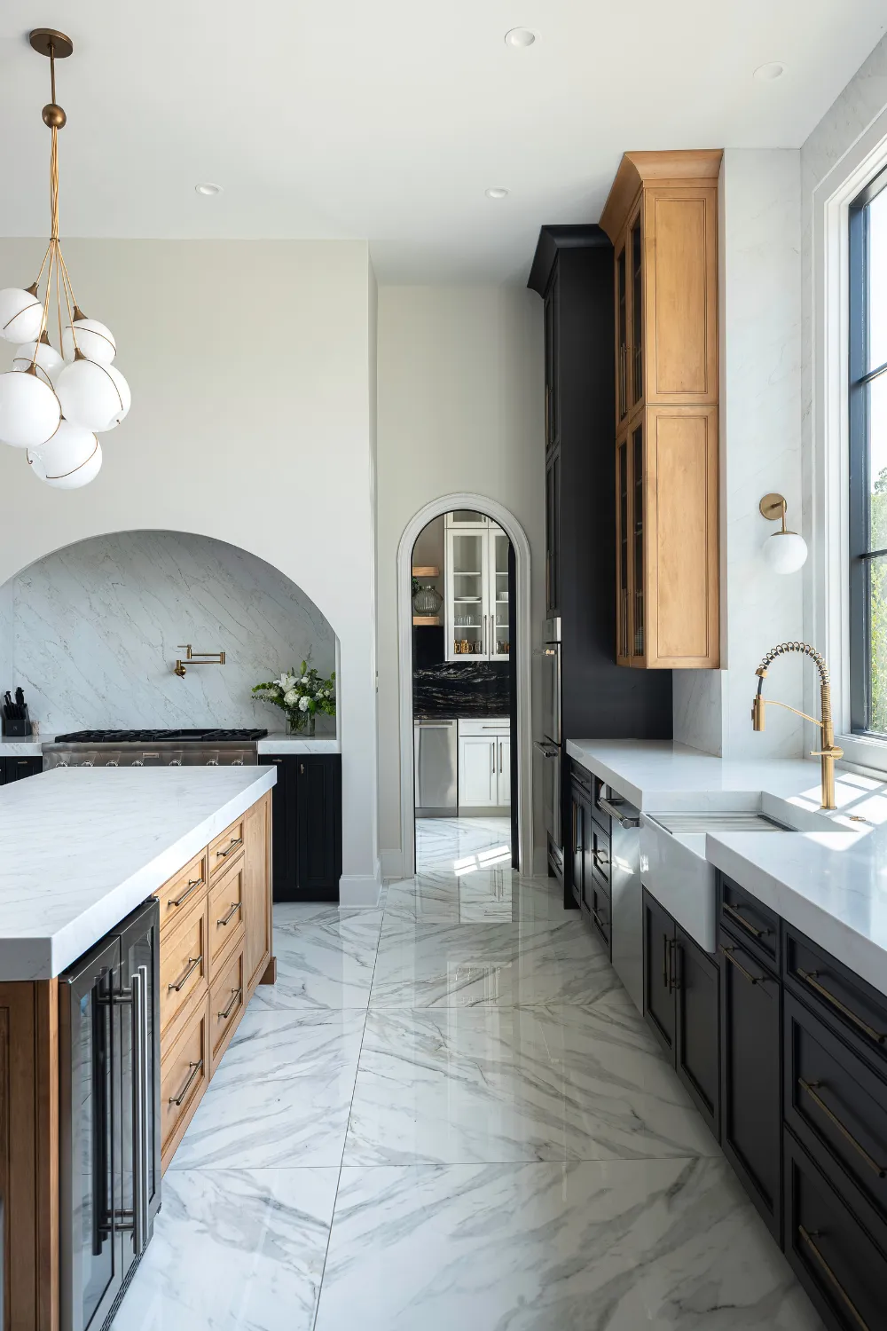 Williamson Residence marble kitchen island and floor-to-ceiling cabinetry